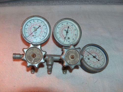 Three vintage robinair gauges mounted with valve handles for sale