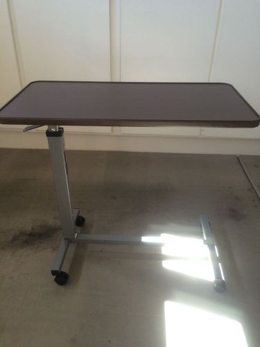 Invacare adjustable over the bed table