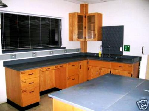 A set of lab furniture. Quality wood cabinets, heavy duty chem. resistant tops.
