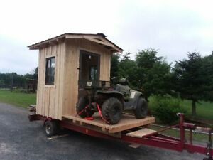 Portable hunting cabin on a boat trailer 
