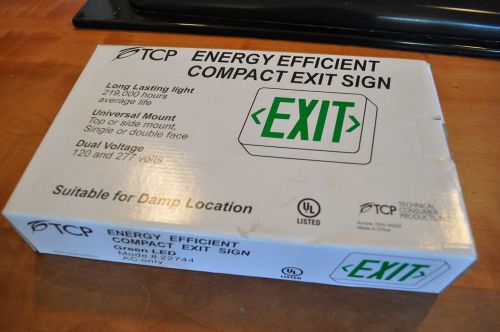 Tcp energy efficient compact exit sign new in box - universal mount green led for sale