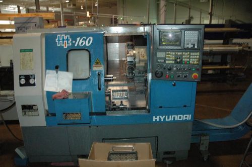 2003 hyundai hit 160, collet nose, 12 station turret, tail stock and conveyor for sale