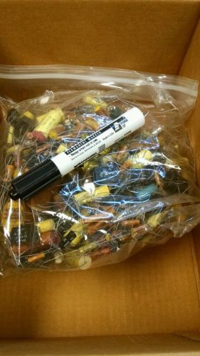 Bag of 100 and 200 volt metallized film capacitors new old stock