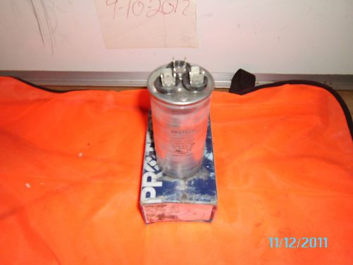 PROTECH DUAL ROUND CAPACITOR #43-25133-25  5+50UF   1026