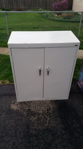 Storage cabinet gray, with lock and key, no shelves for sale