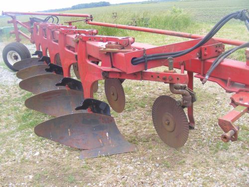 International 720, 5 bottom moldboard tractor plow,with spring cushion coulters.
