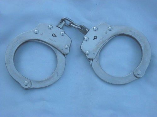 Older peerless handcuff  model 700  chain link nickel finish police handcuffs for sale