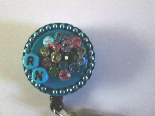 RN CRYSTAL BOUQUET WITH CRYSTAL ON SNAP ID BADGE  REEL,NURSE,MEDICAL,HOSPITAL