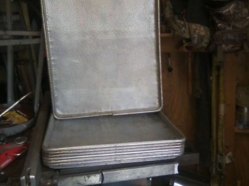 seven bakery oven pans used but in good condition