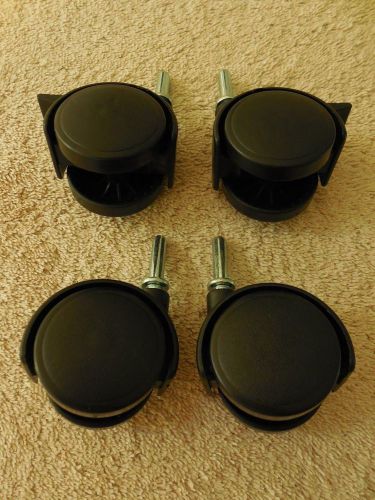 Black cart wheels for shelving racks and units lot of 4 plastic w/ metal w/stop for sale