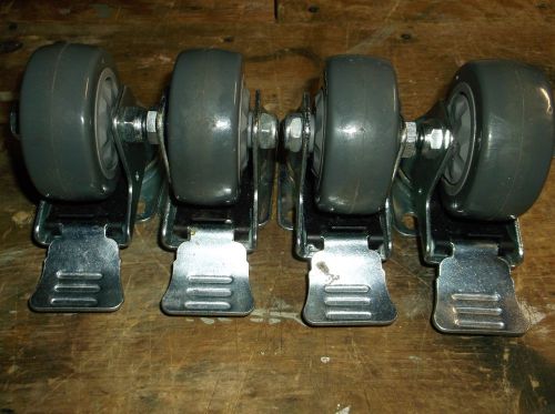 Four  (4) 75 X 32mm Swivil Ball Bearing Casters with Wheel lock