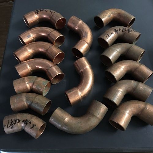 New slightly tarnished smaller assortment of the larger copper fittings for sale