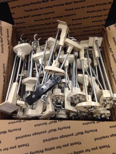 Lot of 30 used alpha locking security pegboard or gridwall hooks with 1 key for sale