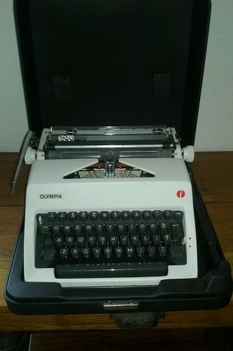 VINTAGE OLYMPIA INTERNATIONAL PORTABLE TYPEWRITER &amp; CASE MADE IN WESTERN GERMANY