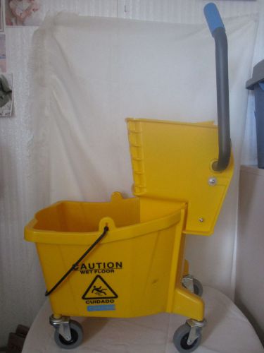 Carlisle mop bucket on wheels w/ side press wringer 26 quart 6.5 gallon yellow for sale