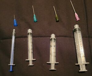 Syringes with blunt needle tips