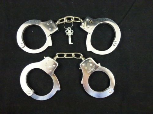 2 pairs of stainless steel handcuffs with 1 key ~ imperial for sale