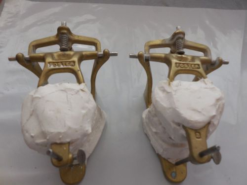 2 Foster Dental Articulators with Cement Intact in Them