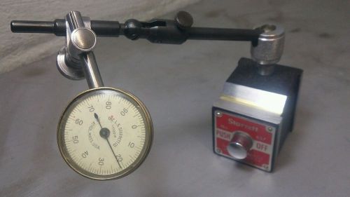 Starrett No. 657A magnetic base with a Starrett No. 196 dial indicator