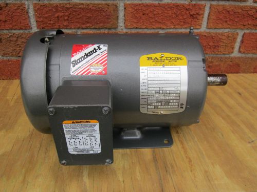 UNUSED M3554T BALDOR STANDARD-E 1 1/2 HP 3 PHASE ELECTRIC MOTOR WITH 7/8 SPINDLE