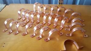 27 pieces of 1 1/2&#034;  Plumbing Fitting Pipe Clip Copper Saddle heavy ribbed.