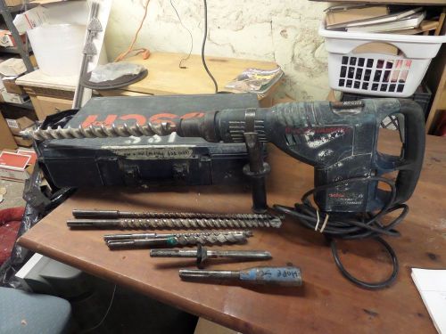 USED BOSCH DEMOLITION HAMMER TURBO 11235EVS WITH 6 BITS AND AN OLD CASE.