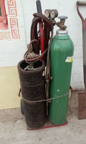 Oxygen acetylene tanks regulators torch 4 tips wrench and cart used for sale