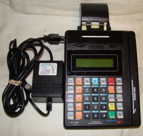 T7 Plus Hypercom credit/debit machine with paper