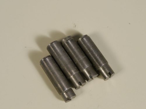 four 1/4-80 fine thread adjusting screws