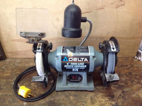 Delta slim-line 6&#034; bench grinder model 23-665. 6&#034; wheels w/ light for sale