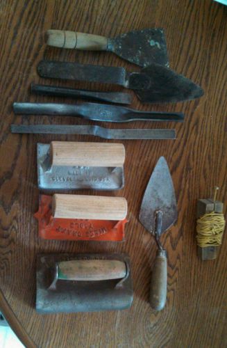 Vintage masonry tools in wooden box
