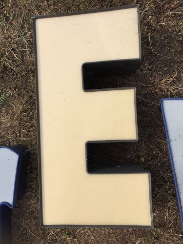 Industrial Tan Channel Aluminum Letter &#034;E&#034; with brown trim and brown exterior