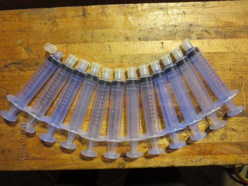 Lot of 12 Syringes with caps