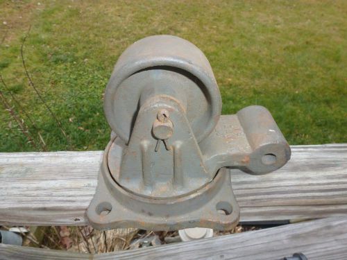 One large steerable  cast iron industrial bond foundry caster for sale