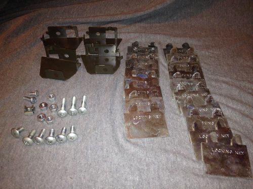 Stainless steel locking keys and  brackets- scrap metal - medical? for sale