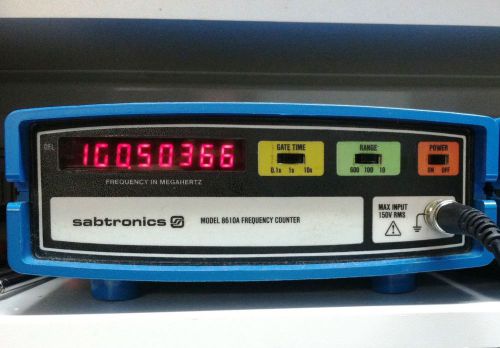 Sabtronics Model 8610A digital frequency counter with test leads