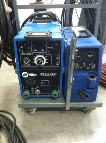 Miller xmt 200 inverter dc power supply with miller wire feeder , spoolgun and m for sale