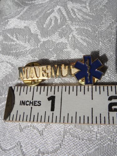 EMT pin badge - NAEMT - with gold letters and blue enamel medical symbol.