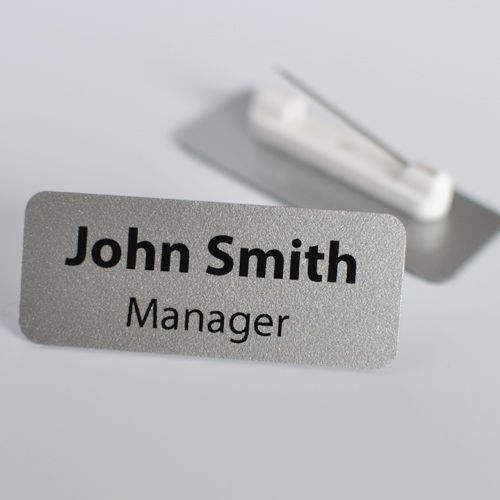 Personalised name badge. silver colour, metallic finish. with safety pin for sale