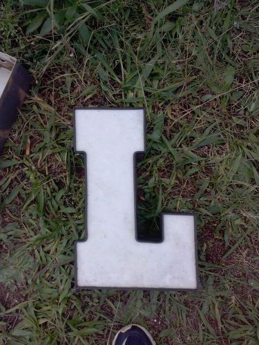 White acrylic face channel letter black trim and exterior upper case &#034;l&#034; for sale