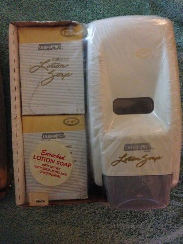 New DERMAPRO LOTION SOAP WALL HANGING DISPENSER BY GOJO with two 27 oz. Soap