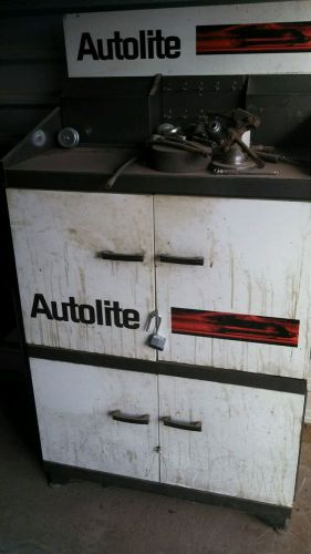 Autolite vintage metal cabinet with parts or without race car emblem on it for sale