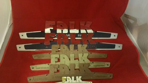 Lot of 6 vintage FALK emblem signs, 2 plastic, 4 metal