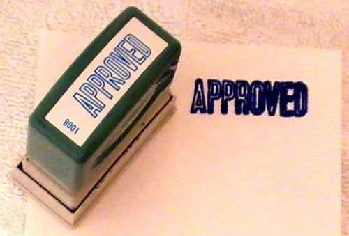 XSTAMPER 1  1/2 ” self inking stamp in blue Capital letters of APPROVED. -
							
							show original title
