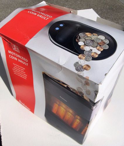 NEW IN BOX, Brookstone Motorized Coin Vault batteries not included.