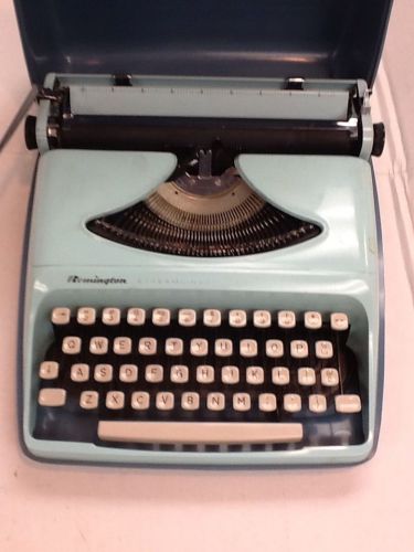 Vintage Turquoise Remington Streamliner Manual Typewriter Made In Holland.