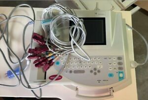 GE MAC 1200 Interpretive 12 Lead EKG Machine w/ power cord and lead cables