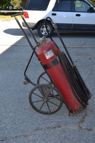 Vintage fire extinguisher rolling cart  class b / c fire wheels. for sale