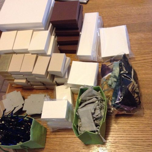 Assorted sizes of jewelry packaging boxes, bags, and cards. 1080 pieces for sale