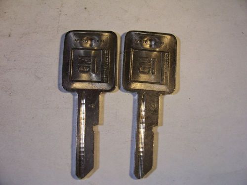 2   NOS  A  GM  KEY BLANK  WITH KNOCKOUT IN PLASE  UNCUT   ORIGINAL